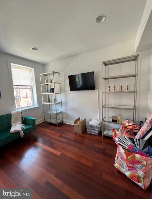 living room featuring dark hardwood / wood-style floors