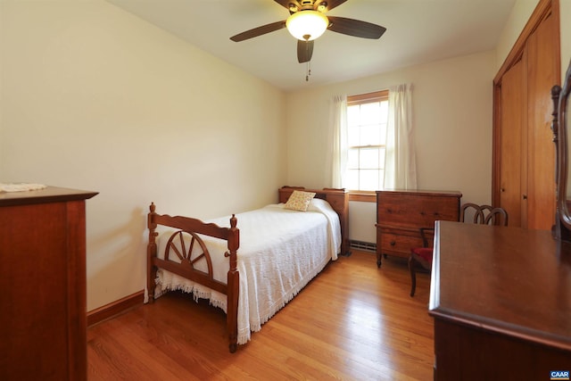 bedroom with ceiling fan and light hardwood / wood-style floors