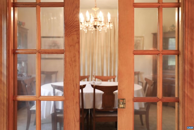 dining area with an inviting chandelier