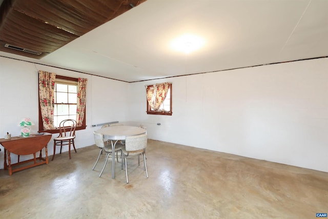 dining room featuring concrete floors