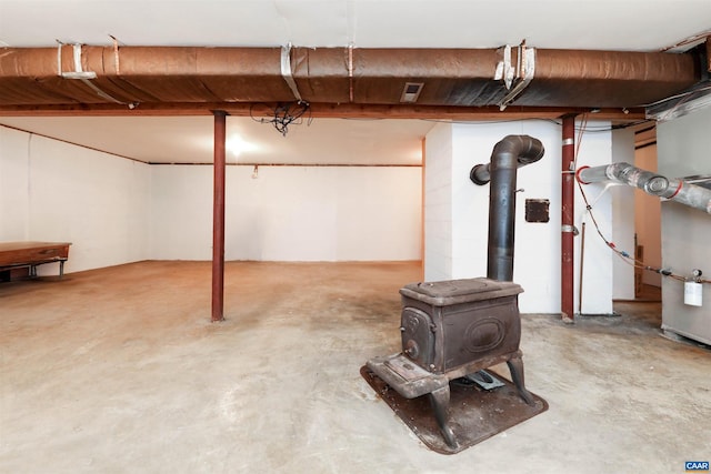 basement featuring a wood stove