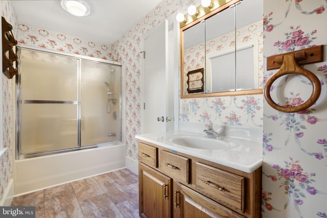 bathroom featuring vanity and enclosed tub / shower combo