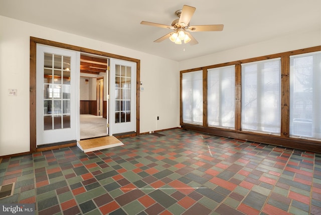 interior space with french doors, ceiling fan, and a healthy amount of sunlight