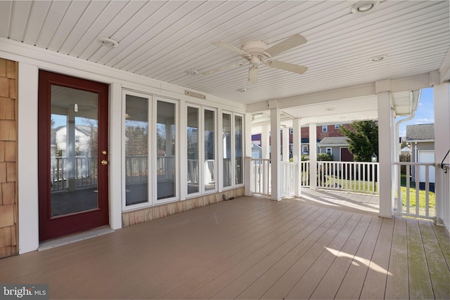 wooden deck with ceiling fan and covered porch