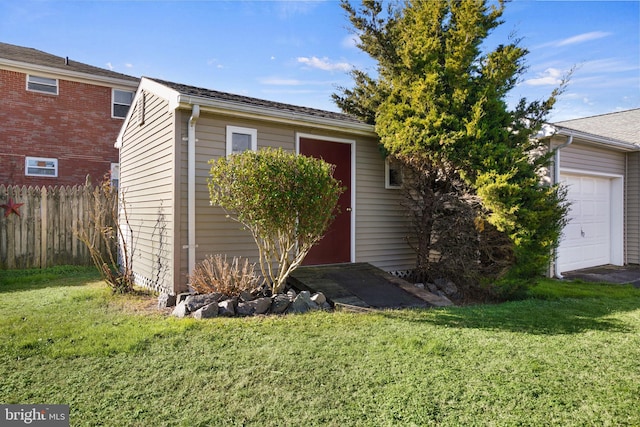 view of front facade with a front yard and a garage