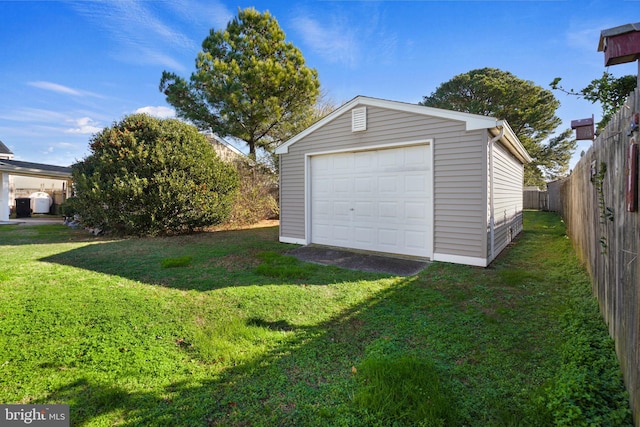 garage featuring a lawn