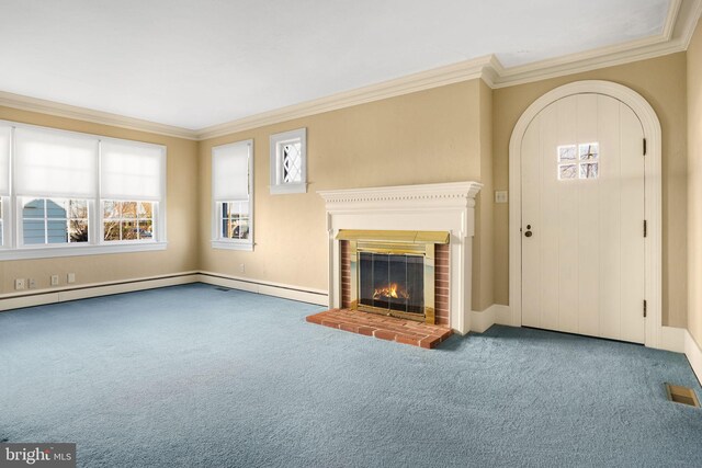 unfurnished living room featuring carpet, baseboard heating, crown molding, and a brick fireplace