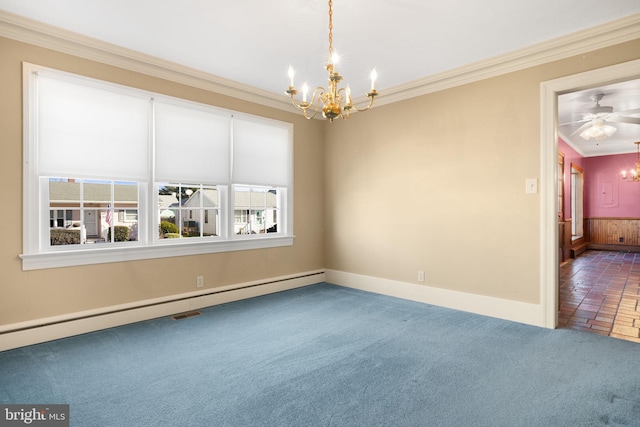 carpeted spare room featuring ceiling fan with notable chandelier, baseboard heating, ornamental molding, and wood walls