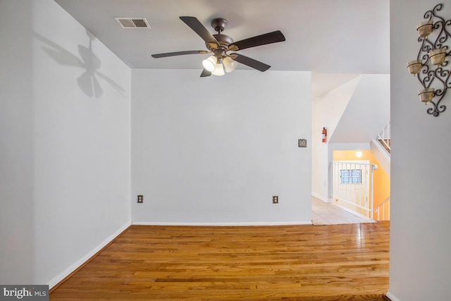 spare room featuring ceiling fan and light hardwood / wood-style flooring