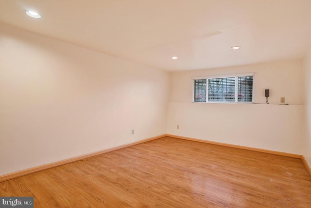 unfurnished room with light hardwood / wood-style floors