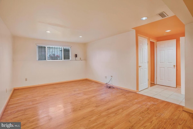 spare room with light hardwood / wood-style flooring