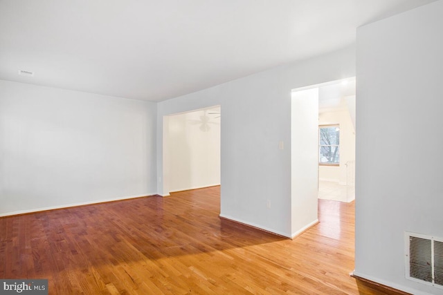 spare room with light wood-type flooring