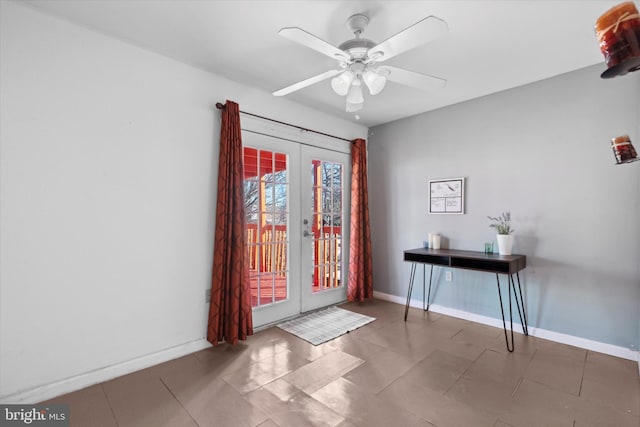 foyer featuring french doors and ceiling fan