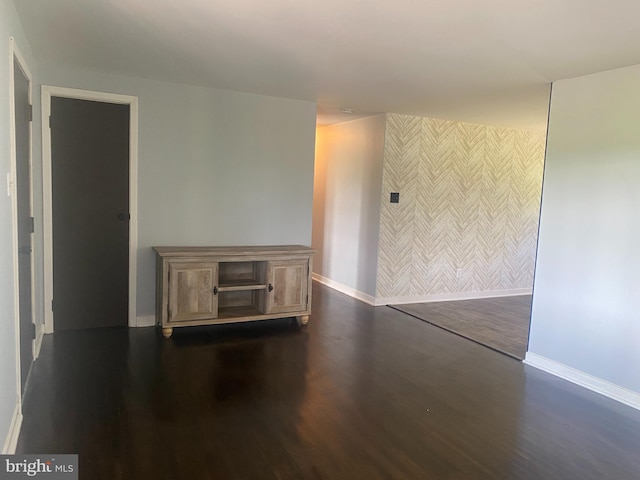 spare room featuring dark hardwood / wood-style flooring