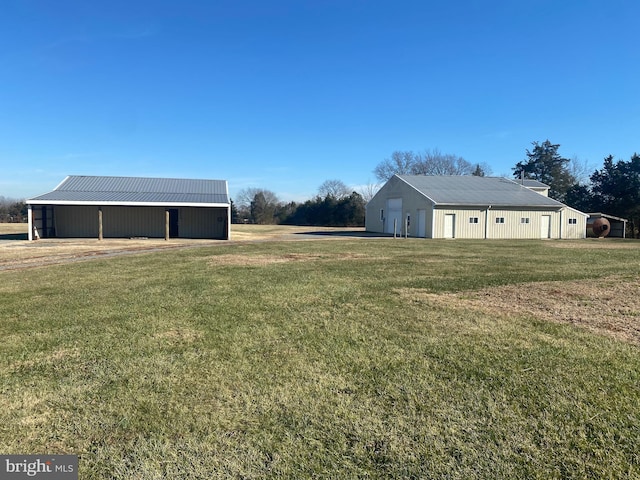 10031 Boteler Rd, Midland, VA 22728 - view of grassy yard featuring an outbuilding, an outdoor structure, and a garage