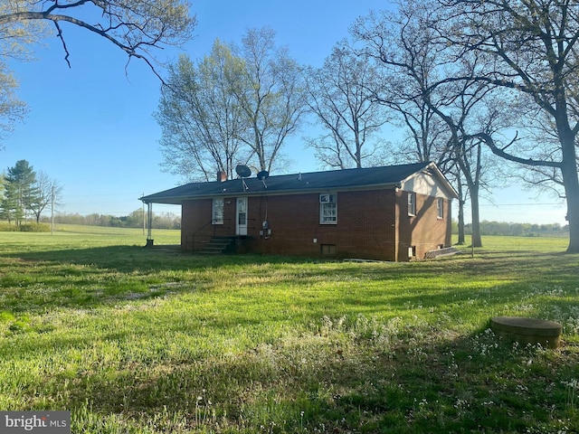 10031 Boteler Rd, Midland, VA 22728 - back of house with a yard, brick siding, a chimney, and entry steps