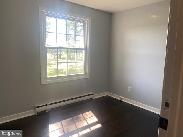 10031 Boteler Rd, Midland, VA 22728 - unfurnished room with a baseboard heating unit, healthy amount of natural light, and dark wood-style floors