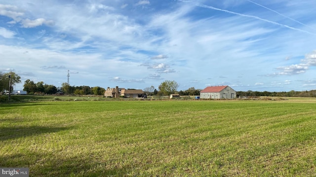 view of yard with a rural view