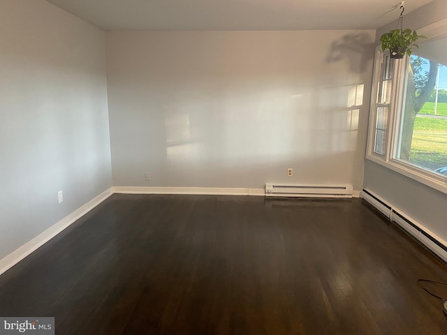 10031 Boteler Rd, Midland, VA 22728 - spare room featuring baseboard heating and dark wood-type flooring