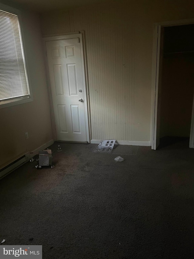 unfurnished bedroom with carpet floors and a closet