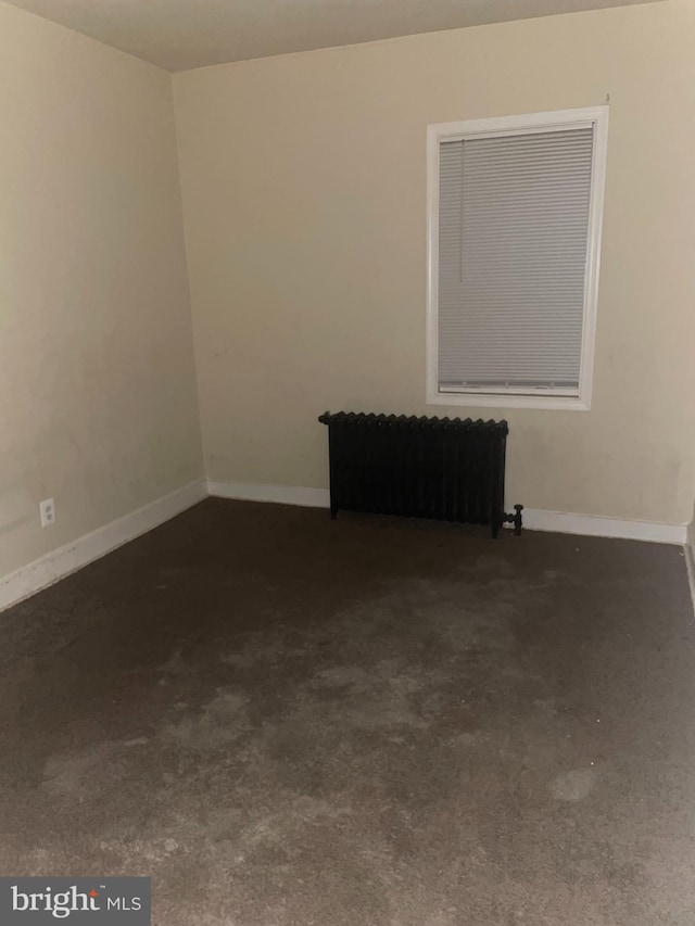 empty room featuring radiator