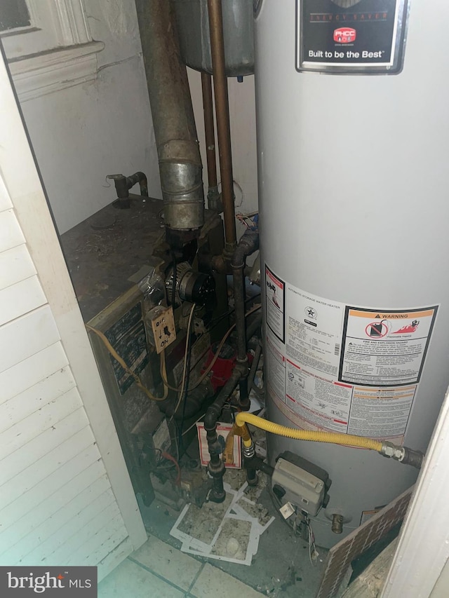 utility room featuring water heater