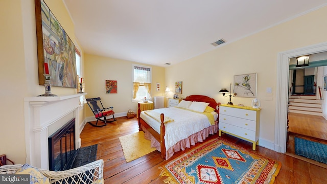 bedroom with hardwood / wood-style floors