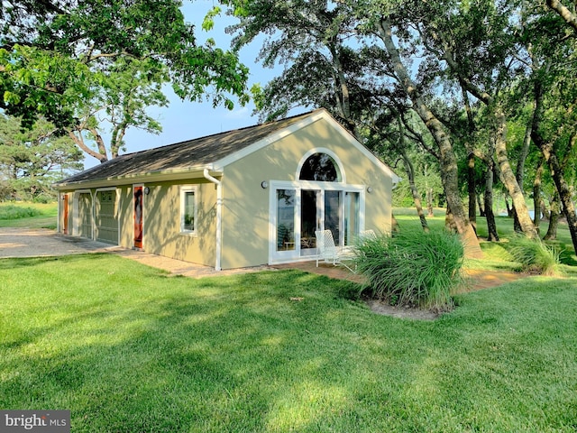 view of side of home featuring a yard