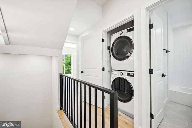 laundry room featuring stacked washing maching and dryer