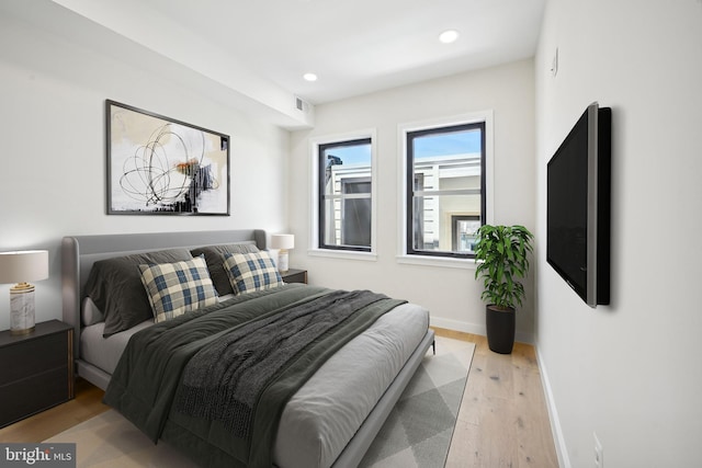 bedroom with light wood-type flooring