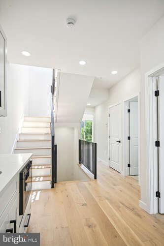 hall with light hardwood / wood-style floors