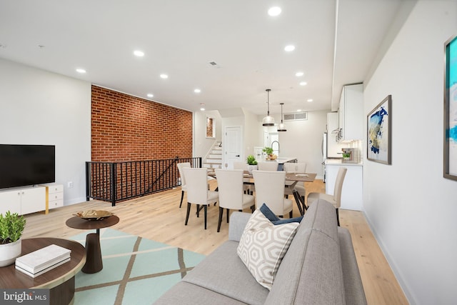 living room with light hardwood / wood-style flooring