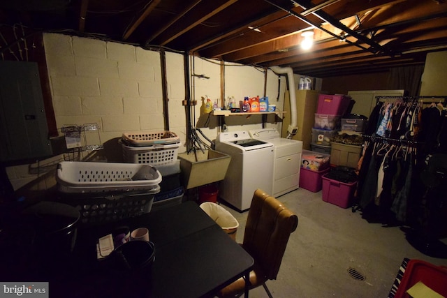 basement featuring electric panel and independent washer and dryer