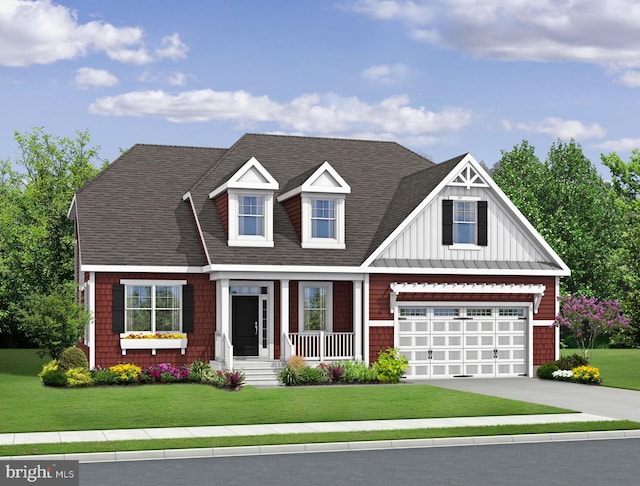 view of front of home featuring a front lawn and a garage