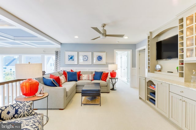 living room with ceiling fan and light carpet