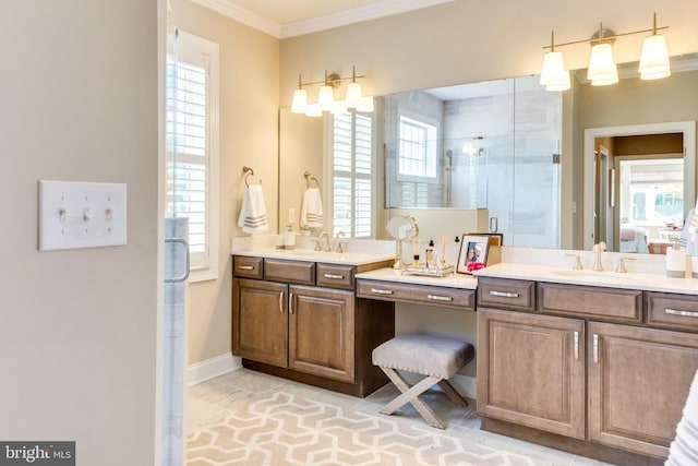 bathroom featuring an enclosed shower, vanity, ornamental molding, and a healthy amount of sunlight