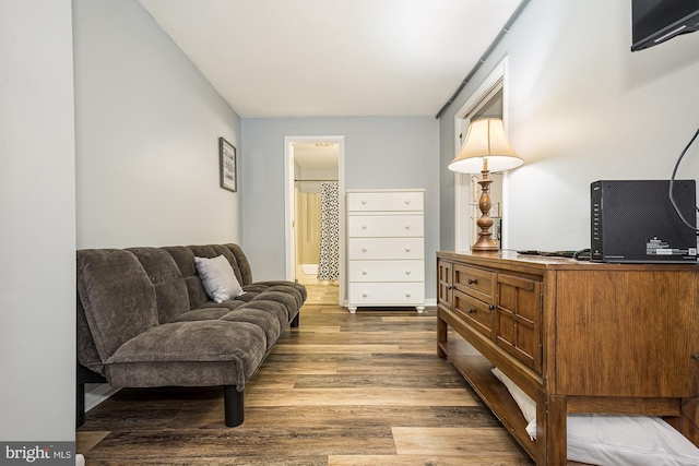 living area with hardwood / wood-style flooring