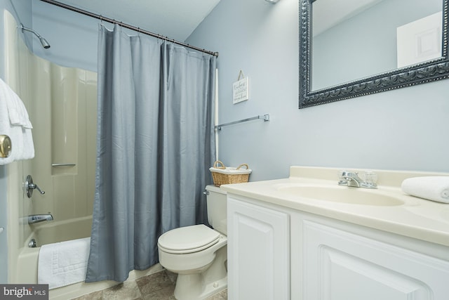 full bathroom featuring vanity, shower / bath combination with curtain, and toilet