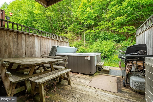 deck featuring a hot tub