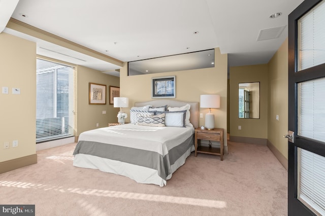 bedroom featuring light carpet and crown molding