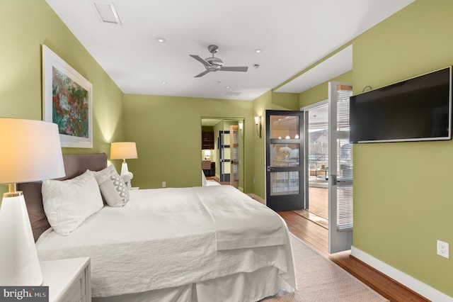 bedroom with access to outside, ceiling fan, and light hardwood / wood-style flooring