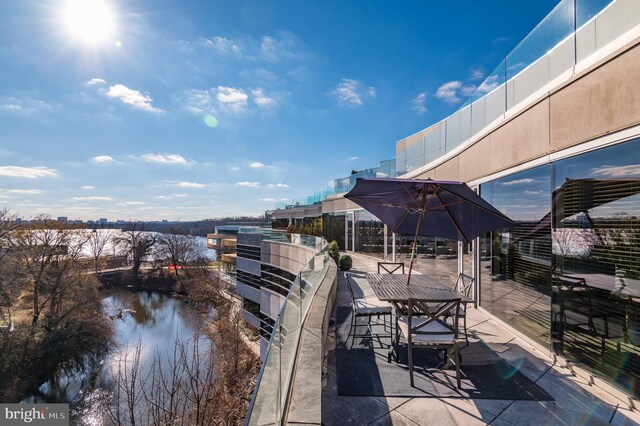 view of patio with a water view