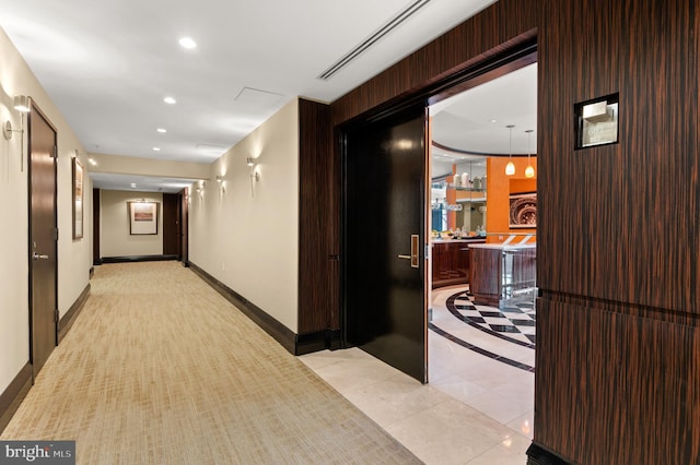 hallway featuring light tile patterned floors