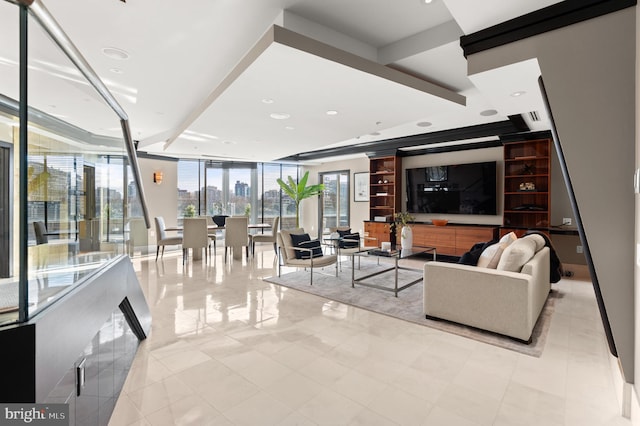 living room featuring expansive windows and light tile patterned floors