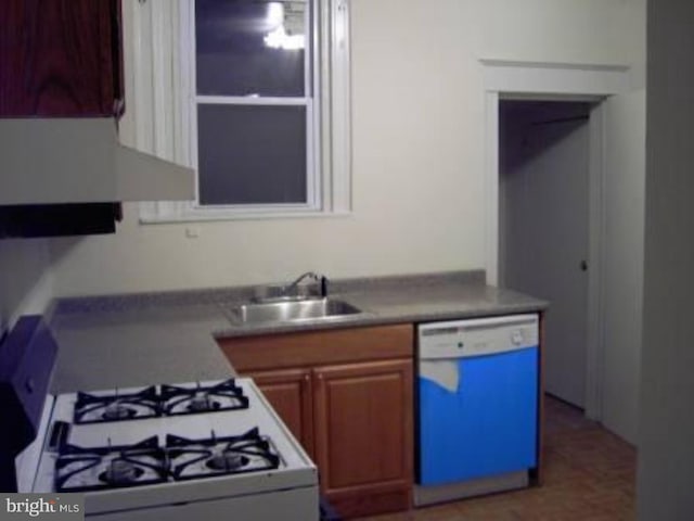 kitchen with white appliances and sink