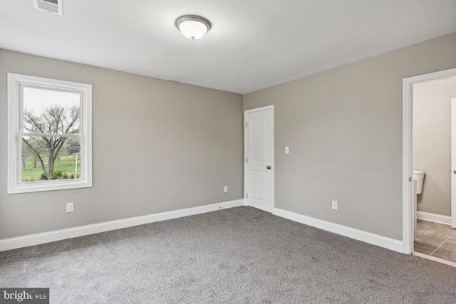 empty room with carpet flooring