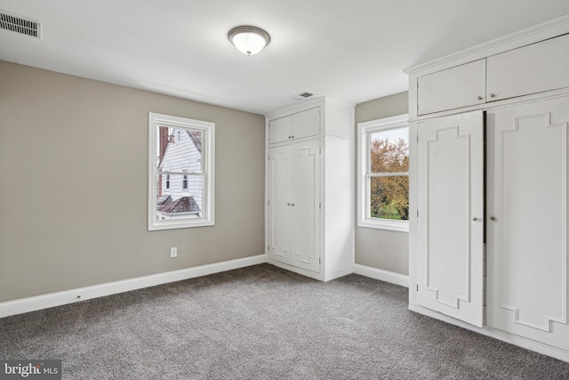 unfurnished bedroom featuring carpet