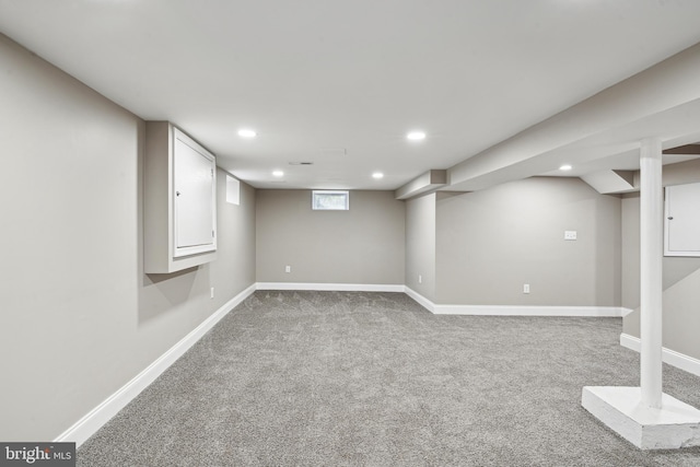 basement with light colored carpet