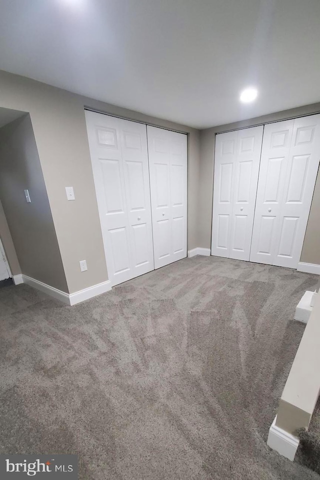 unfurnished bedroom with carpet flooring