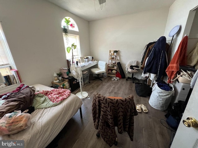 bedroom with hardwood / wood-style floors